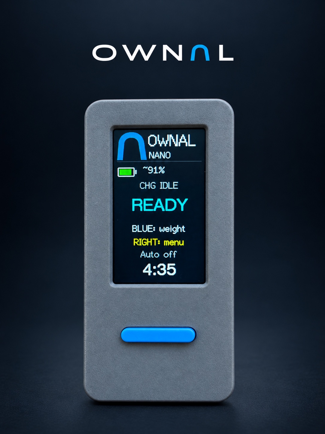 OWNAL Controller with its READY screen and blue front button, photographed with a retouched graphite studio background
